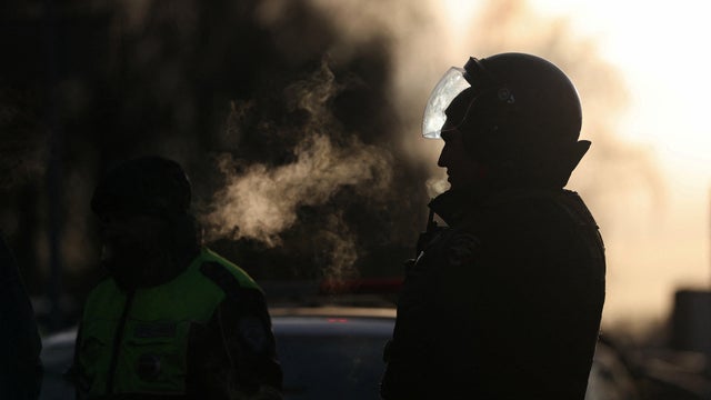 Law enforcement officers work near the site of a blast in Moscow 