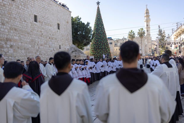 Christmas procession outside the Church of the Nativity in Bethlehem 