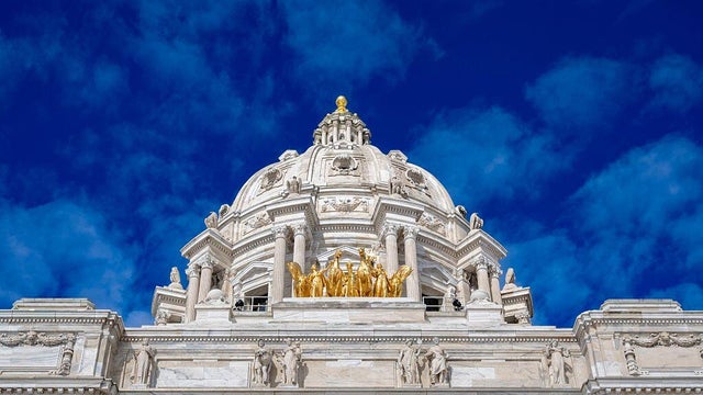 Minnesota state capitol with Golden horses and blue sky 