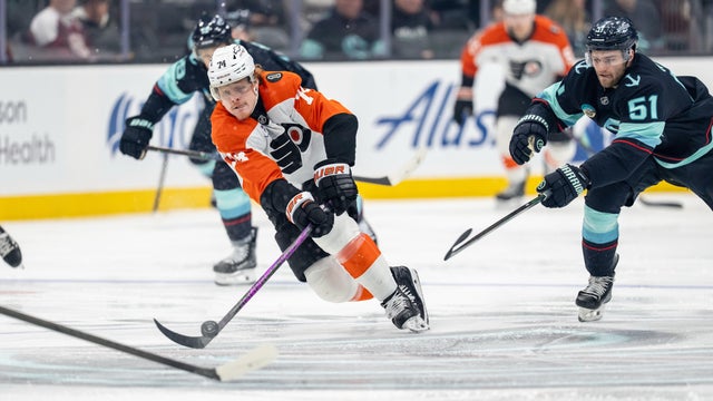 Philadelphia Flyers forward Owen Tippett, left, skates against Seattle Kraken forward Shane Wright, during a game in Seattle 