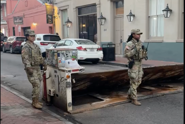 National Guard troops at a security barrier on a street in New Orleans 