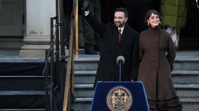 New York mayor Zohran Mamdani waves next to his wife Rama Duwaji during his public inauguration ceremony followed by a block party at City Hall in New York on January 1, 2026. 