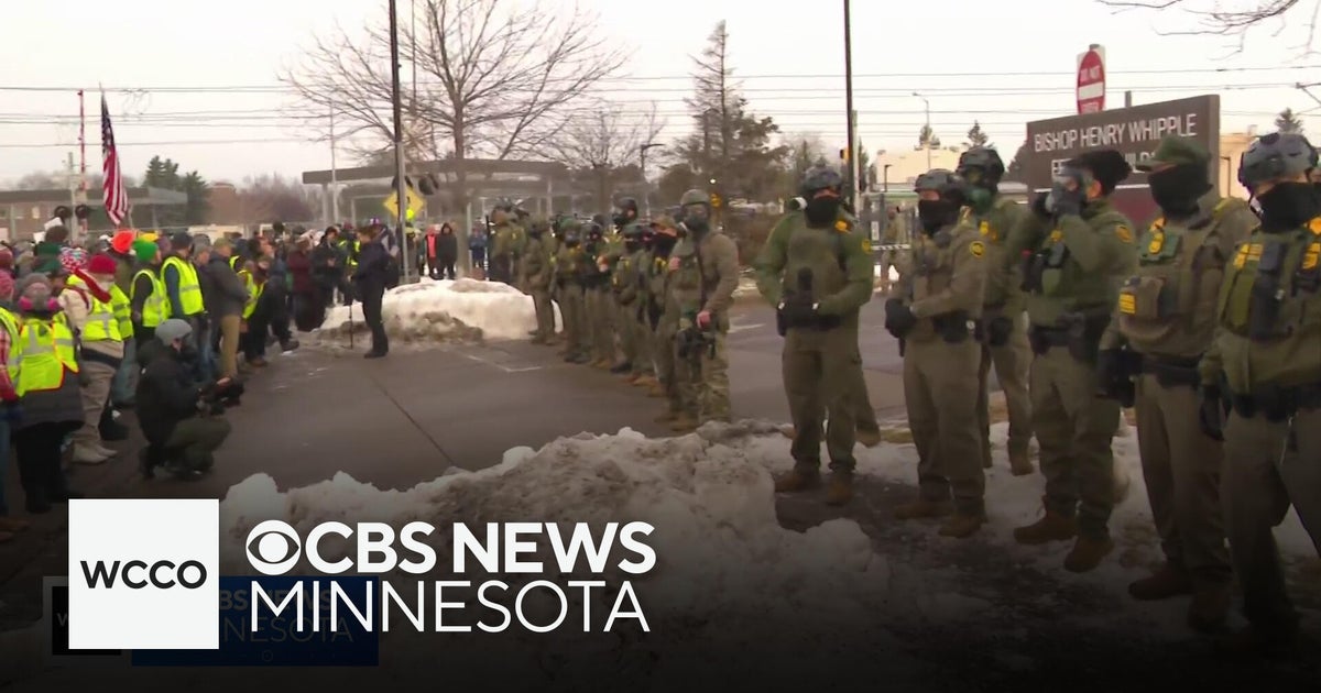 Tensions high outside Minneapolis federal building after fatal ICE shooting