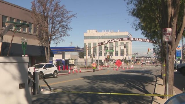 Caution tape closes a street intersection 