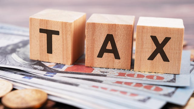 Tax Text on Wood Block 