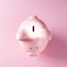 Spotlight Focused on the Coin Slot of a Piggy Bank 