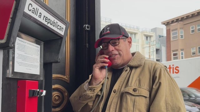 A man talking on a phone that connects people to a Republican in Texas 