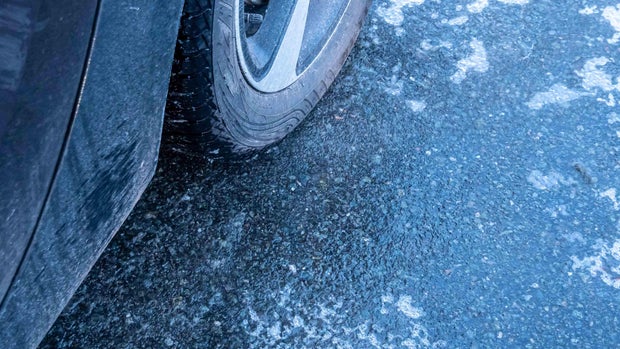 icy road surface in winter black ice, black ice 