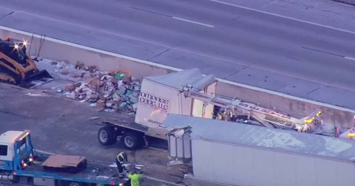 I-65 reopens after U.S. mail trailer crashes, splits open