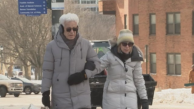 A couple from Fairmount walk arm in arm 