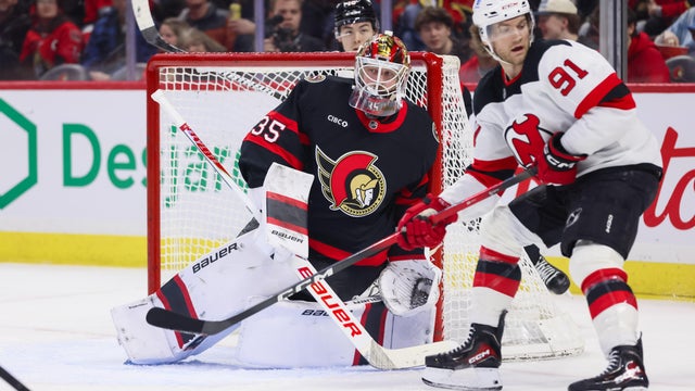 Linus Ullmark #35 of the Ottawa Senators tends net with Dawson Mercer #91 of the New Jersey Devils skating to the front of the net on January 31, 2026, at Canadian Tire Centre in Ottawa, ON, Canada. 