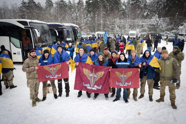 Ukrainian prisoners of war (POWs) pose for a picture after a swap at an undisclosed location in Ukraine 