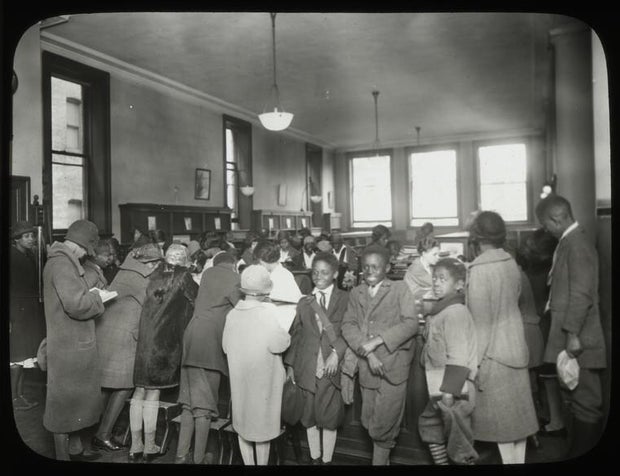 135th-street-nypl-children-in-front-of-childrens-charging-desk.jpg 