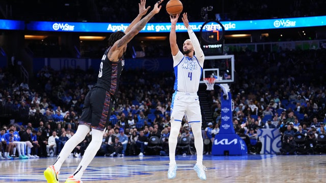 Jalen Suggs #4 of the Orlando Magic goes up for a shot against Nic Claxton #33 of the Brooklyn Nets during the third quarter at Kia Center on February 05, 2026 in Orlando, Florida. 