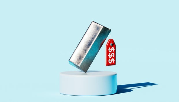 Silver Metal Ingot on Pedestal with Red Price Tag for Commodity Value Concept