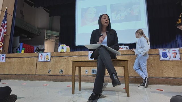 Jamila Winder reads to students during a Black History Month event 