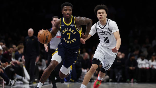 Kam Jones #7 of the Indiana Pacers dribbles the ball past Nolan Traore #88 of the Brooklyn Nets during the first quarter at Barclays Center on February 11, 2026 in the Brooklyn borough of New York City. 