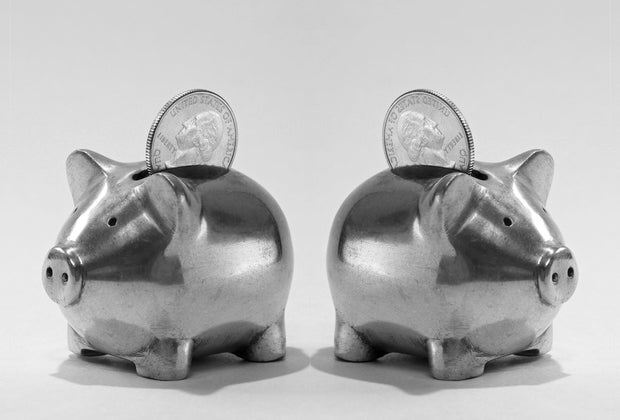 Two tiny  metallic  piggy banks with American 4th   coins 