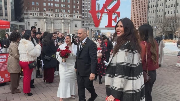 DeAnna Diaz and Manny Melendez celebrate their wedding in LOVE Park