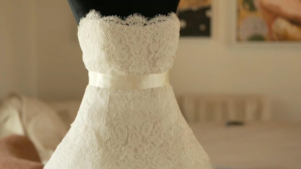 A conversation between two strangers led to a single wedding dress helping 13 brides