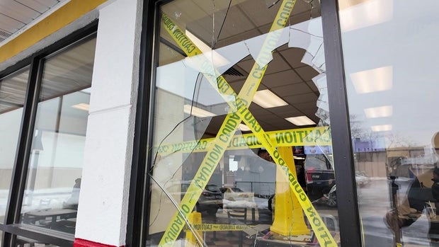 Broken McDonald's window with caution tape 