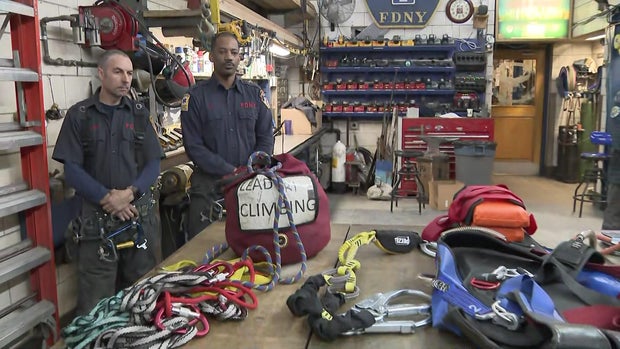 Firefighters with ropes and harnesses 