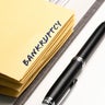ring binder with word BANKRUPTCY written on binding divider 