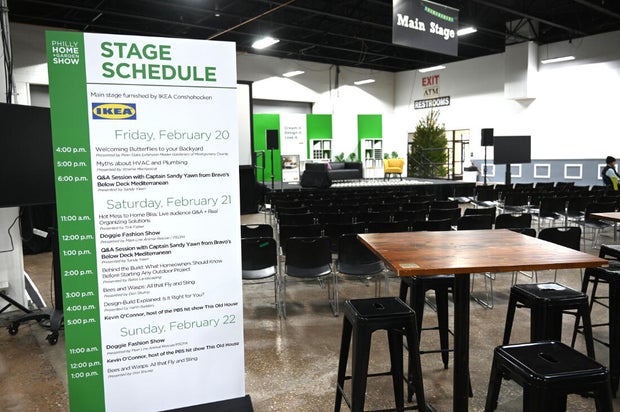 People pose for a photo at the opening day of the Philly Home and Garden show 