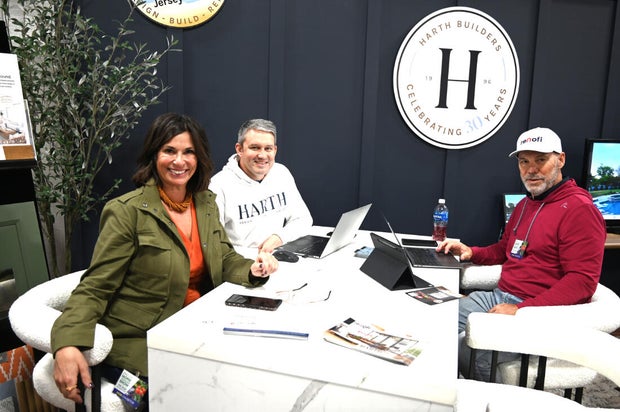 People pose for a photo at the opening day of the Philly Home and Garden show 