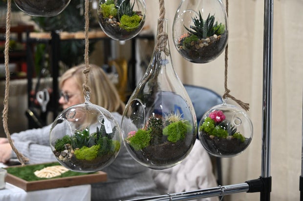 People pose for a photo at the opening day of the Philly Home and Garden show 