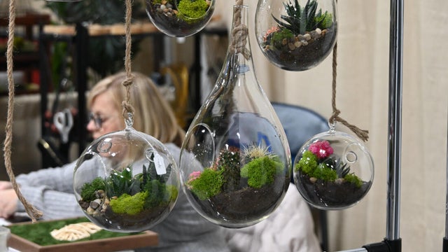People pose for a photo at the opening day of the Philly Home and Garden show 
