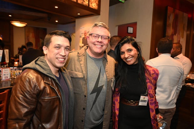 People pose for a photo at the opening of the Philly LGBTQ+ visitor center 