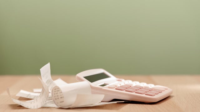 Calculator and bills on table. Calculating expenses, paying bills, personal finance 