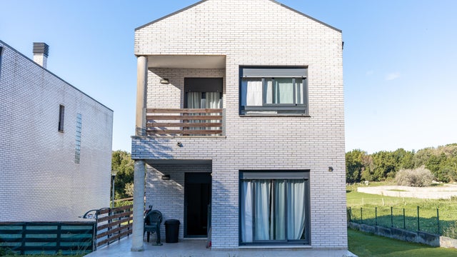 detached house with garden on a sunny day 
