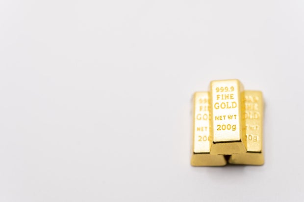 A lot of simulated gold bricks are on the table 