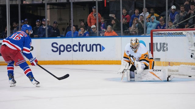 New York Rangers center Vincent Trocheck (16) shoots the puck past Pittsburgh Penguins goaltender Stuart Skinner (74) during a shootout in an NHL hockey game Saturday, Feb. 28, 2026, in New York. 