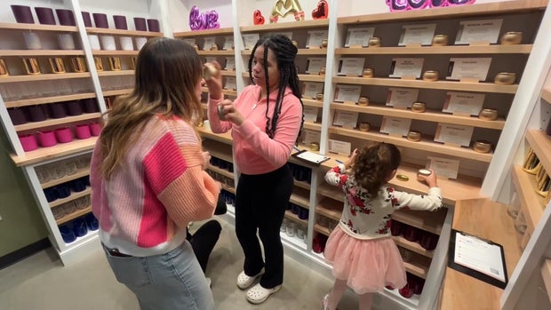 Customers try scents at Cork and Candles in Ardmore, Pennsylvania 