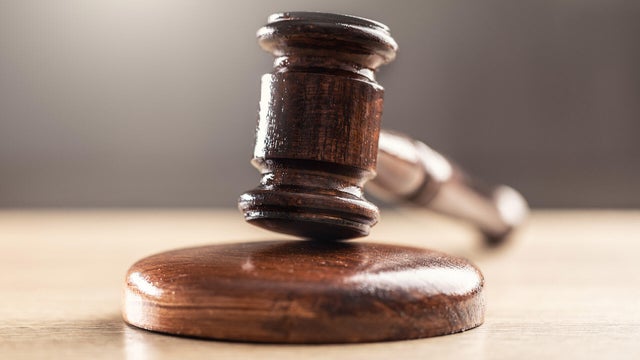 Judge's gavel on a wooden table - Close up 