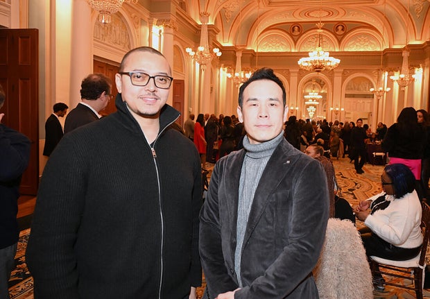 People post for photos at Alvin Ailey American Dance Theater Party at Ensemble Arts 