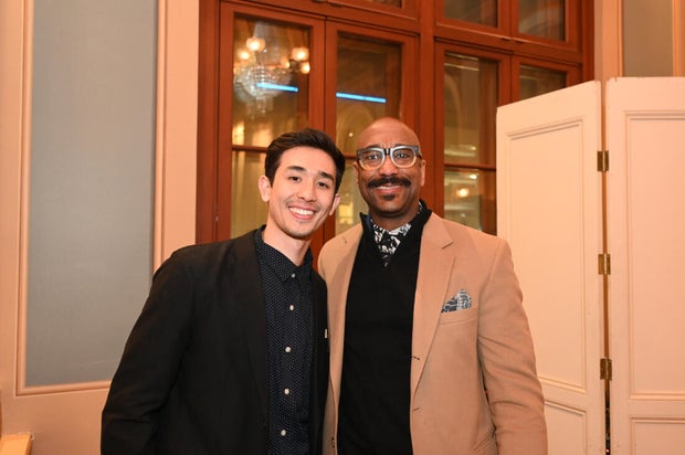 People post for photos at Alvin Ailey American Dance Theater Party at Ensemble Arts 