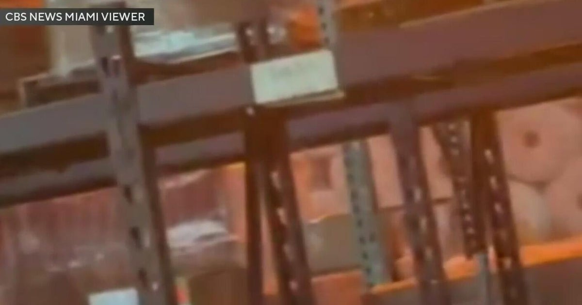 Firefighters continue to fight the Miami-Dade warehouse fire one day after the blaze