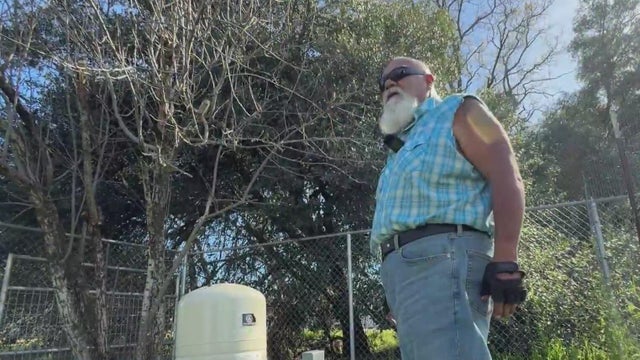 A man standing in a lawn 