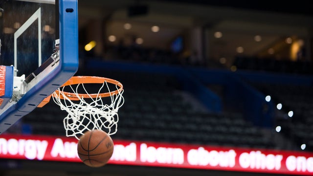 Basketball in hoop, blurred motion 