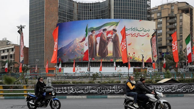 A banner of Iran's new supreme leader Mojtaba Khamenei with late supreme leader Ayatollah Ali Khamenei, in Tehran 