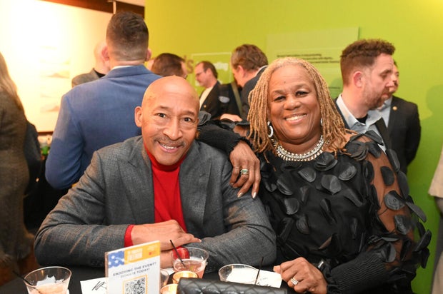 People pose for photos during an event at the National Liberty Museum 