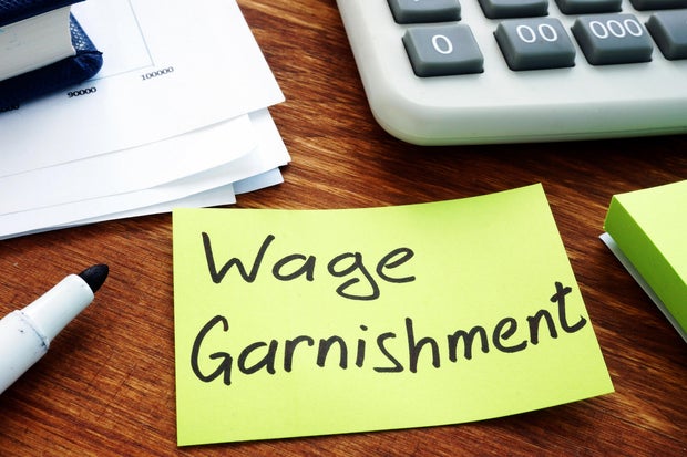 Wage Garnishment written on the yellow sheet. 