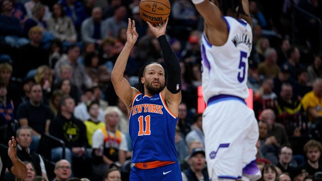 New York Knicks guard Jalen Brunson (11) shoots over Utah Jazz forward Cody Williams (5) during the first half of an NBA basketball game, Wednesday, March 11, 2026, in Salt Lake City. 