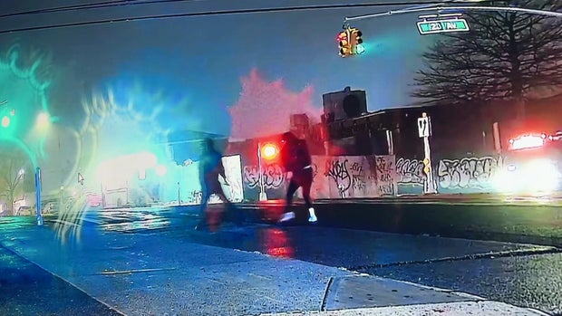 Two people in the middle of the street 