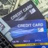 Credit cards and dollars in cash 