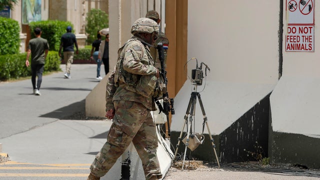 U.S. and French soldiers stand guard in the Green Zone of the Iraqi capital of Baghdad on May 22, 2025. 